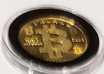 Design D — binary and BTC symbols · Brass